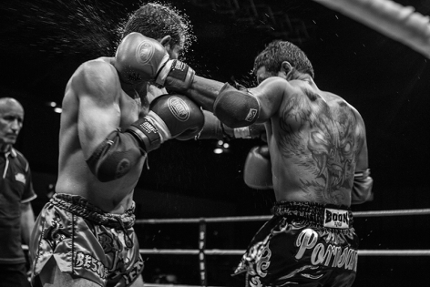  Pornsanae Sitmonchai and Yetkin Ozkul striking simultaneus punches during their fight at the event ‟Best of Siam IV‟.