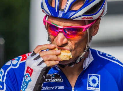  FDJ team member eats before the start of the tour ‟ Eurométropole 2014‟.