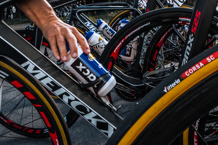  Member of team (Topsport Vlaanderen-Baloise) supplies bikes with water bottles before the start of the first stage of the tour ‟Eurométropole 2014‟.